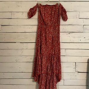 Red flower dress. The bottom is short to long. Off the shoulder sleeves.
